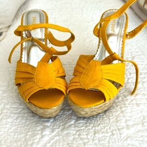 Yellow wedge sandals.  Size 7.